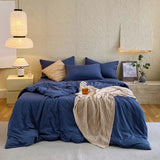 Housse de couette bleu coton avec boutonnière de coté sur les taies d'orreillé