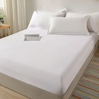 Drap Housse Elastique et Doux en Coton, de couleur blanche, sur un lit.