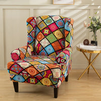 Housse de Fauteuil Extensible Multicolore avec Mandalas sur un fauteuil avec une petite table à droite